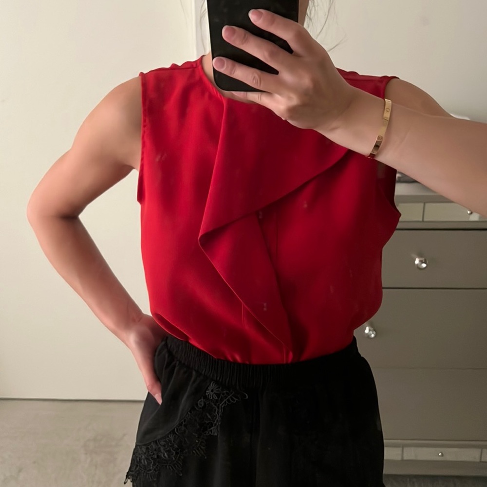 Red sleeveless blouse